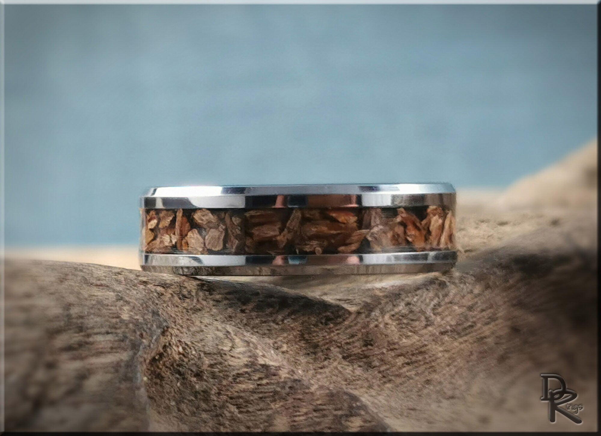 DR Rings tungsten ring with dinosaur bone inlay showcasing a unique textured brown fossil design