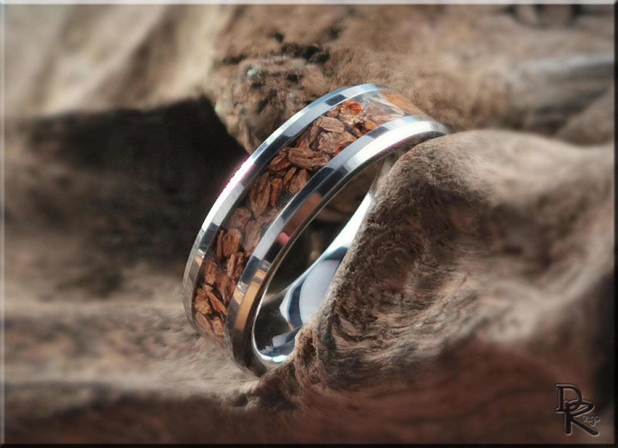 Tungsten ring with dinosaur bone inlay by DR Rings featuring a polished silver finish and natural brown bone details