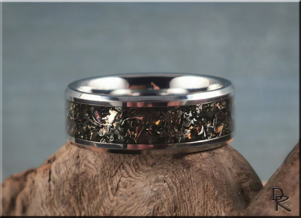 Tungsten ring with meteorite inlay featuring a polished silver band and unique cosmic pattern