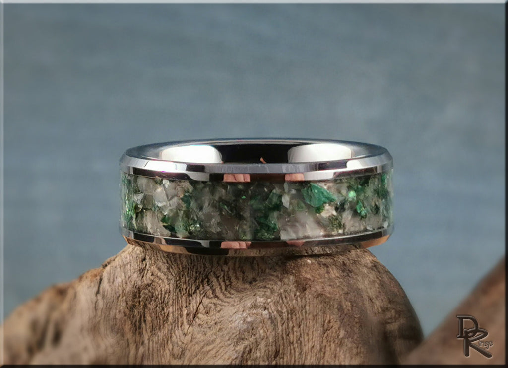 DR Rings tungsten ring with moonstone inlay featuring green and white stone details on wood background
