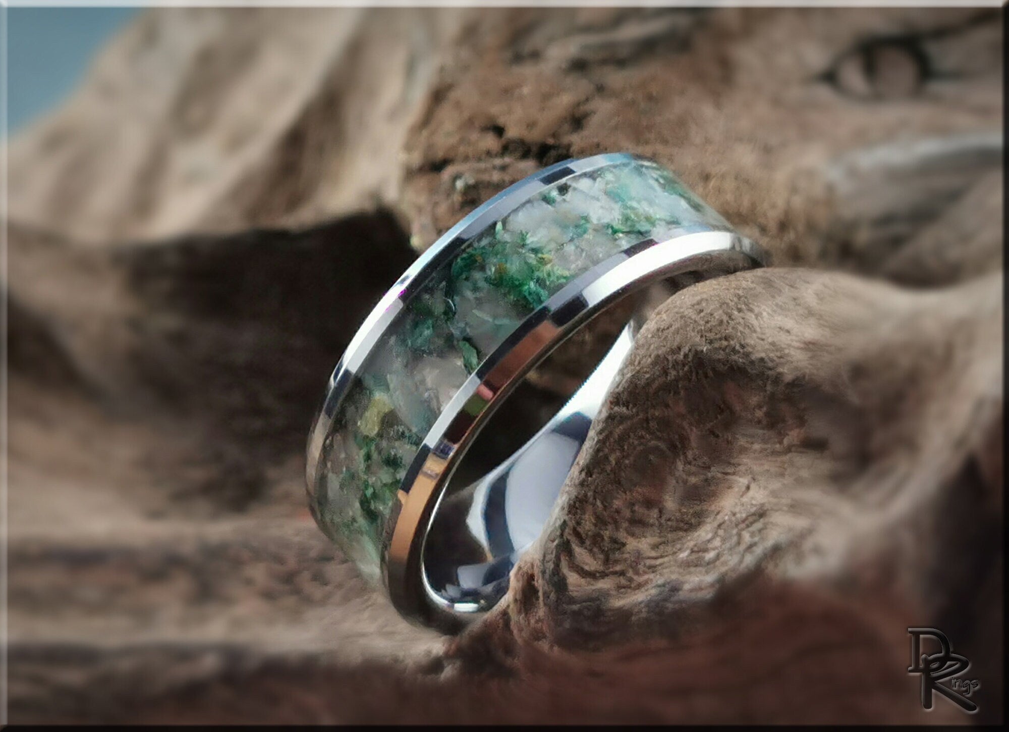 DR Rings tungsten ring with moonstone featuring green and white stone inlay on a polished silver band