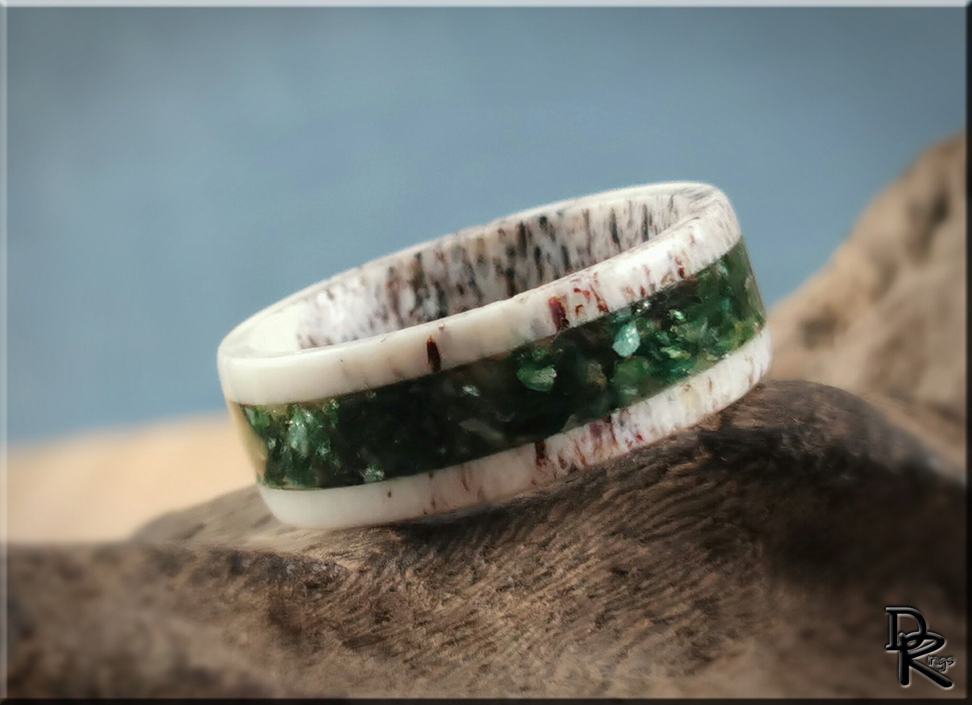 Antler ring with mica featuring a white antler base and a green mica inlay by DR Rings