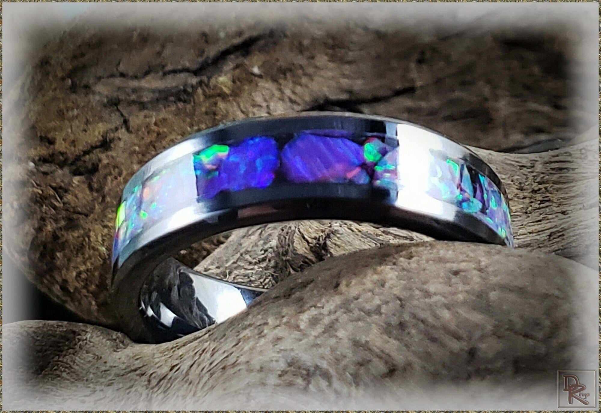 Oura ring 4 ceramic style with vibrant blue and green opal inlays on a dark band from DR Rings