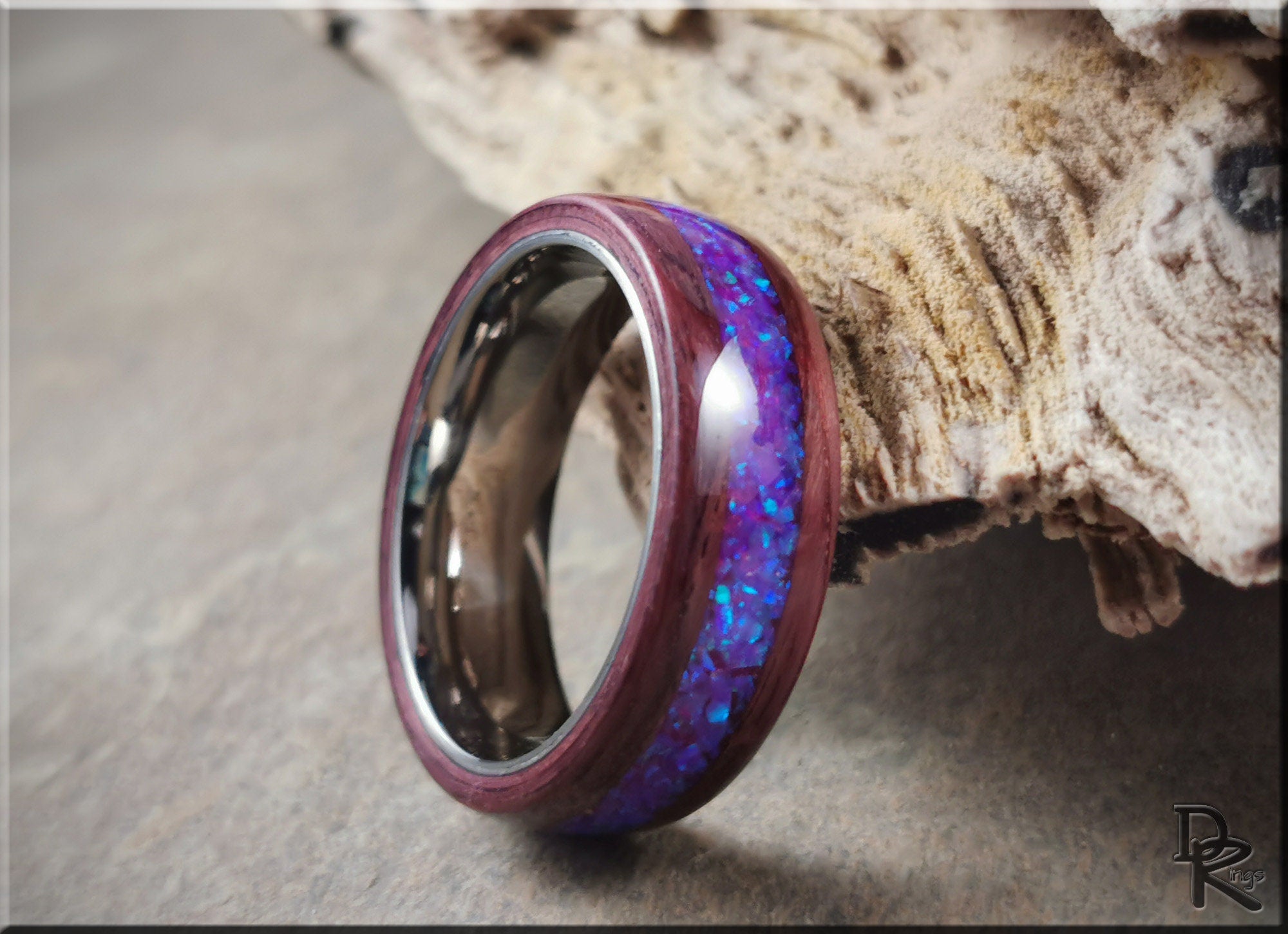 Purpleheart wood ring with opal inlay featuring vibrant blue and purple colors by DR Rings