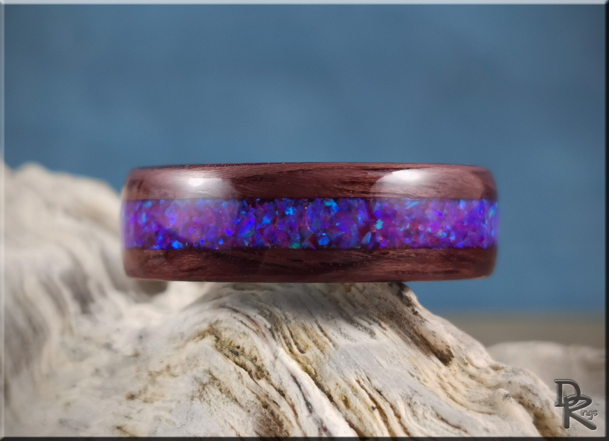 Purpleheart wood ring with opal inlay showcasing vibrant blue and purple colors by DR Rings