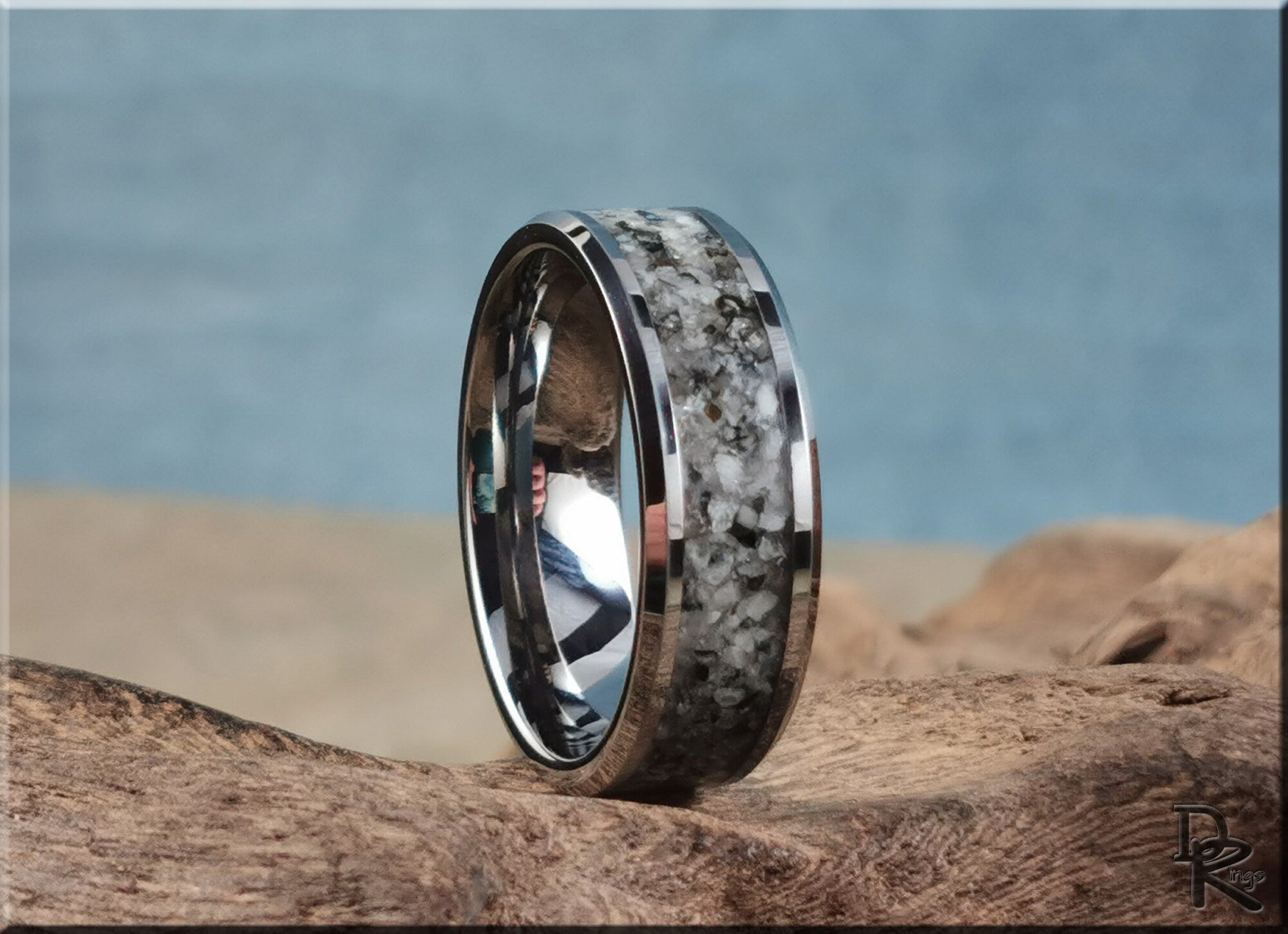 DR Rings tungsten ring with moonstone inlay featuring a polished silver edge and unique stone pattern