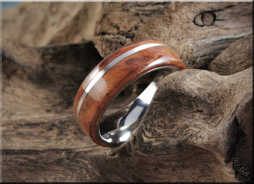 DR Rings redwood ring with inlay featuring polished wood and metal band on rustic wood background