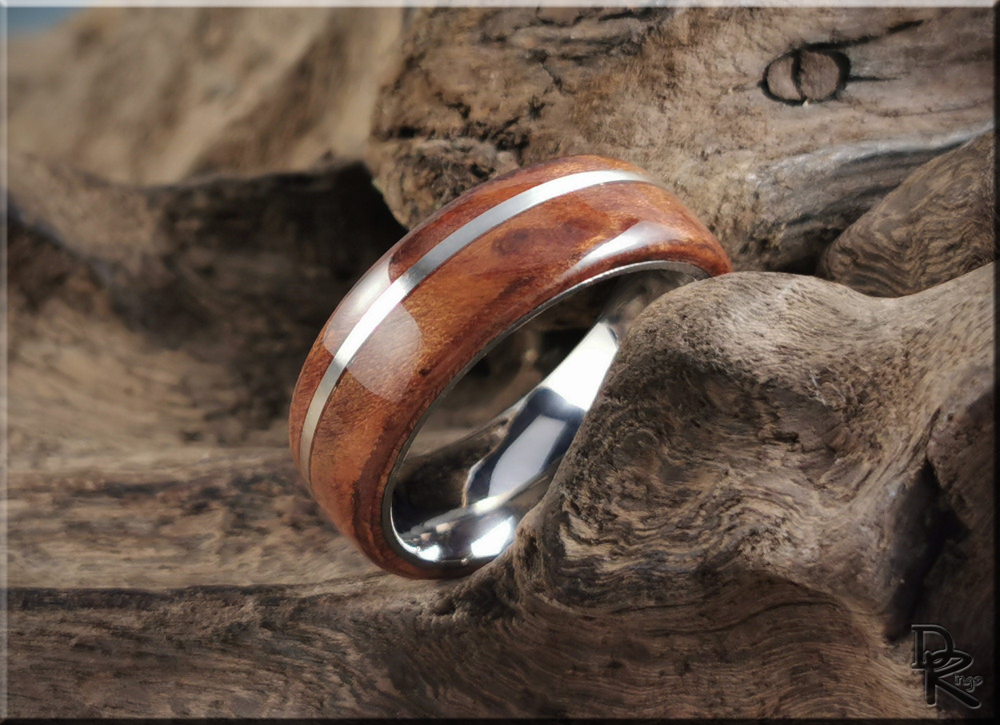 DR Rings redwood ring with inlay featuring polished wood and metal band on rustic wood background