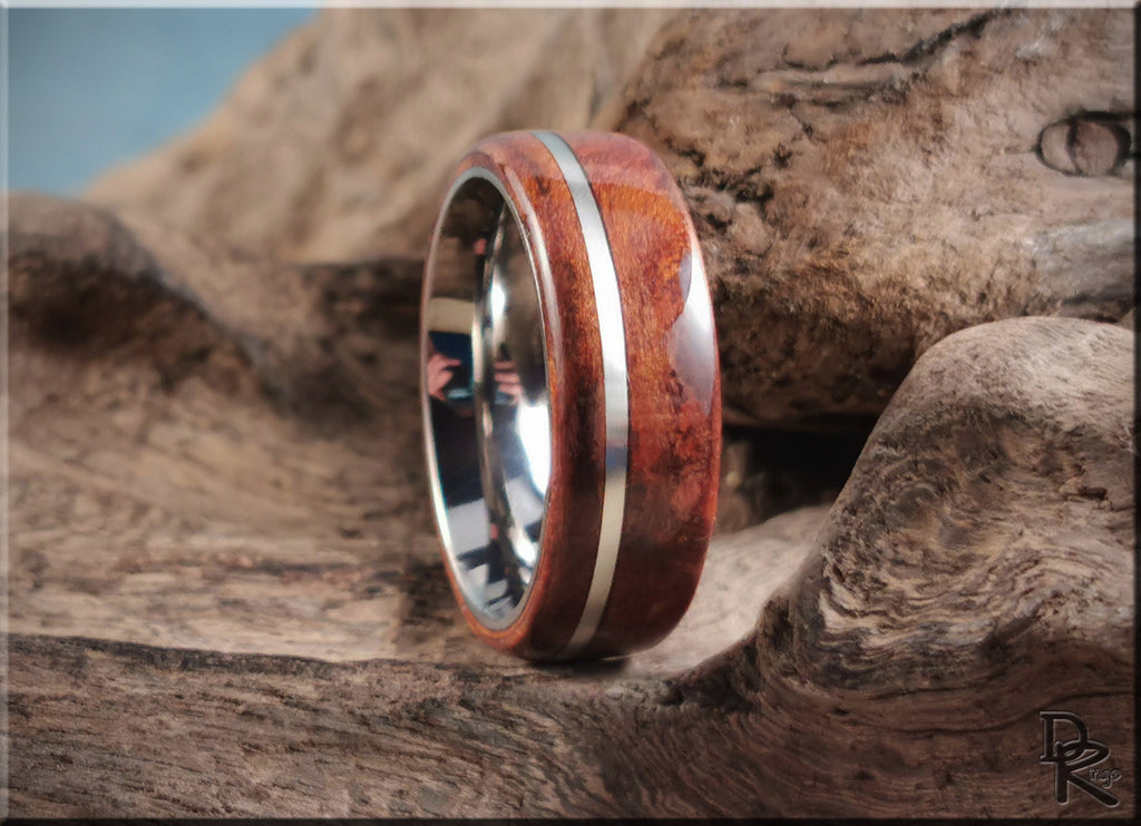 DR Rings redwood ring with inlay featuring polished wood and metal band on textured wood background