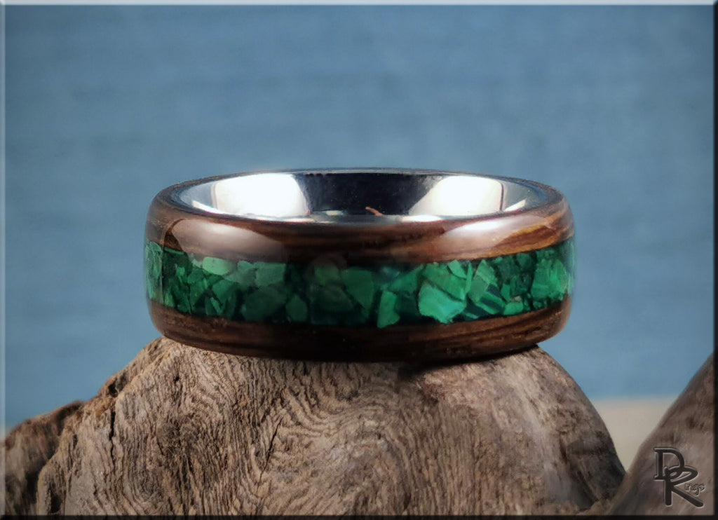 DR Rings band featuring ancient bog oak with malachite inlay on polished metal background