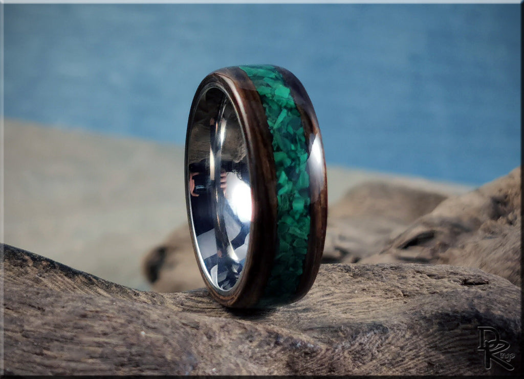 DR Rings ring featuring ancient bog oak with malachite inlay on natural wood background