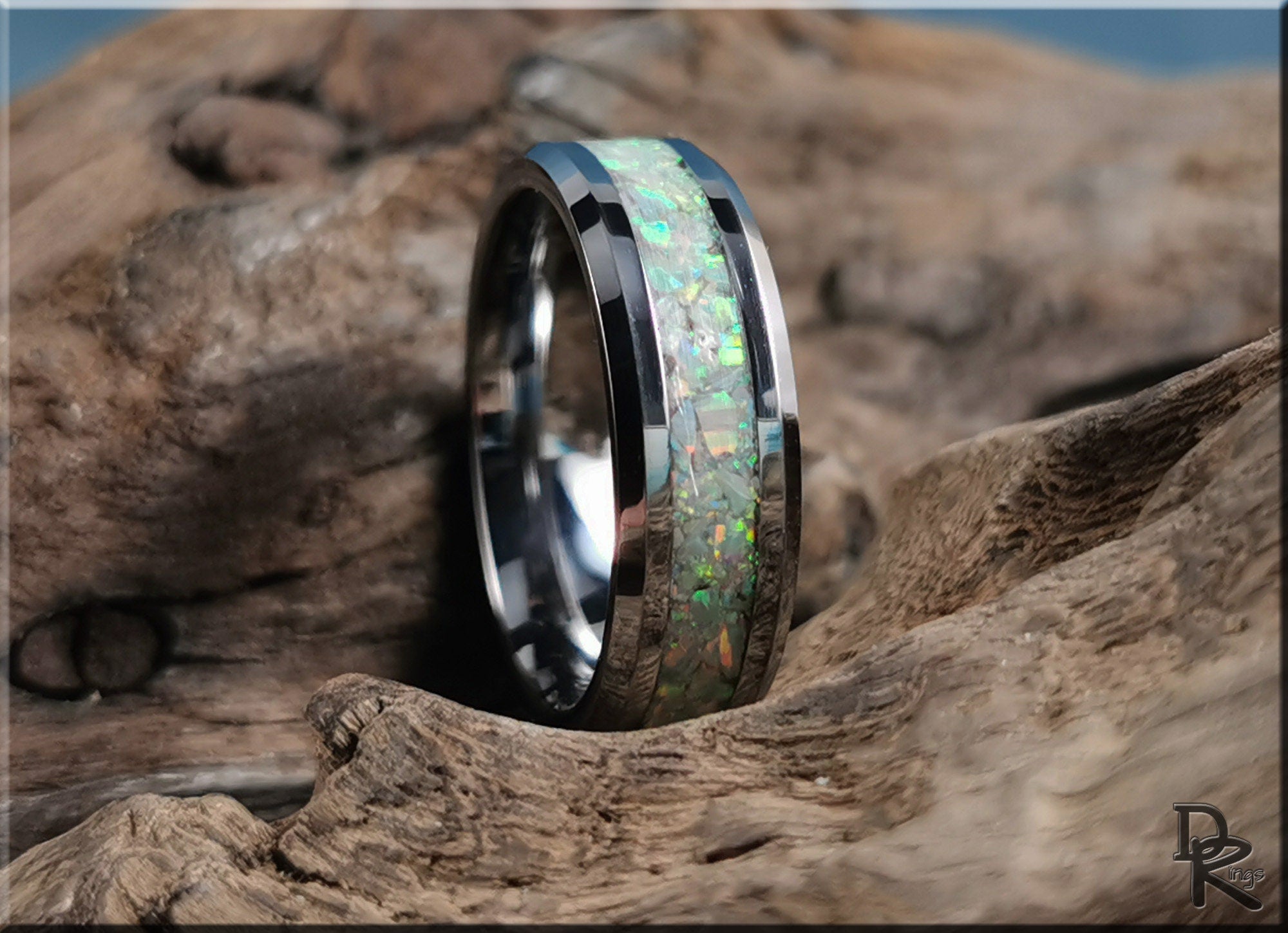 DR Rings ring opal with shiny silver band and iridescent opal inlay on rustic wooden background