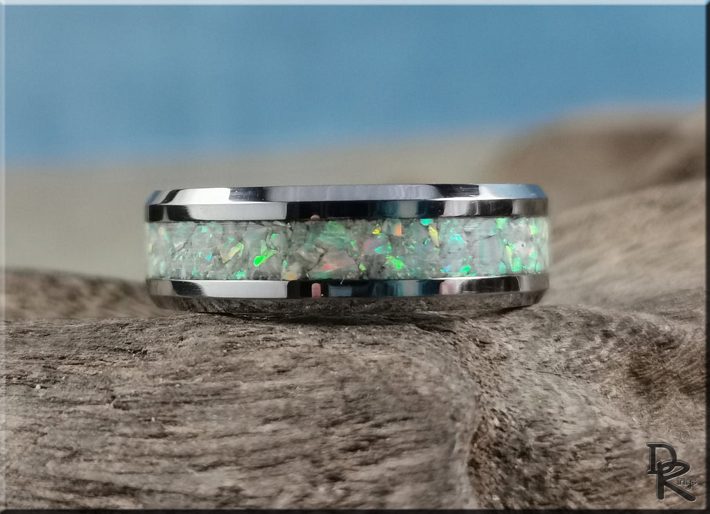 DR Rings men's band with bright sparkling ring opal inlay on rustic wood background