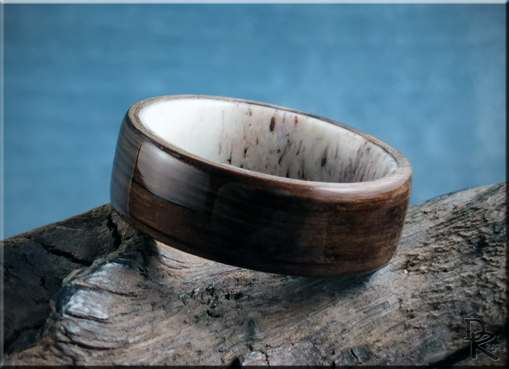 DR Rings handcrafted ring featuring polished bog oak wood with a smooth white inner band