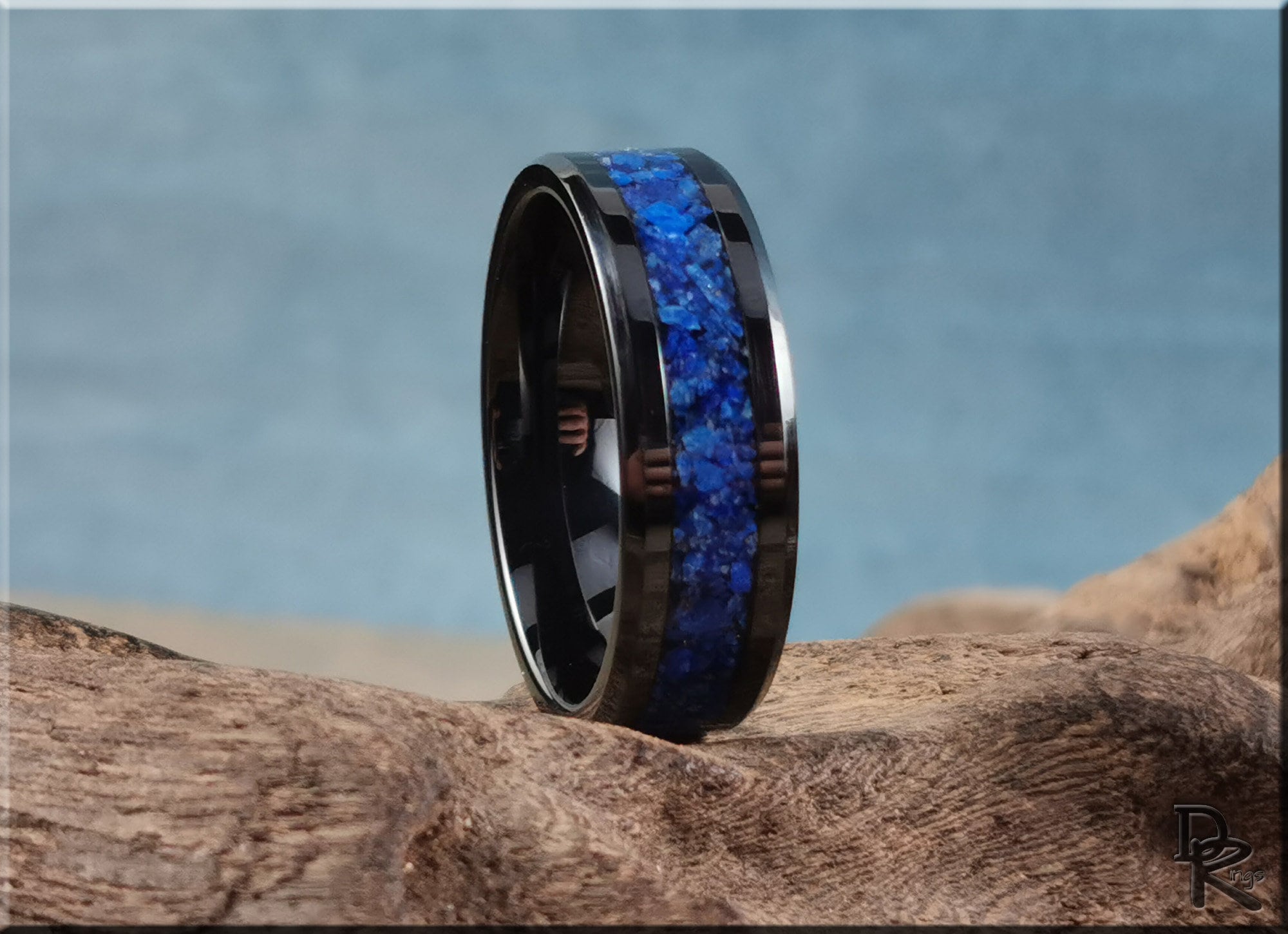 Ceramic ring with lapis blue stone inlay by DR Rings on natural wood background
