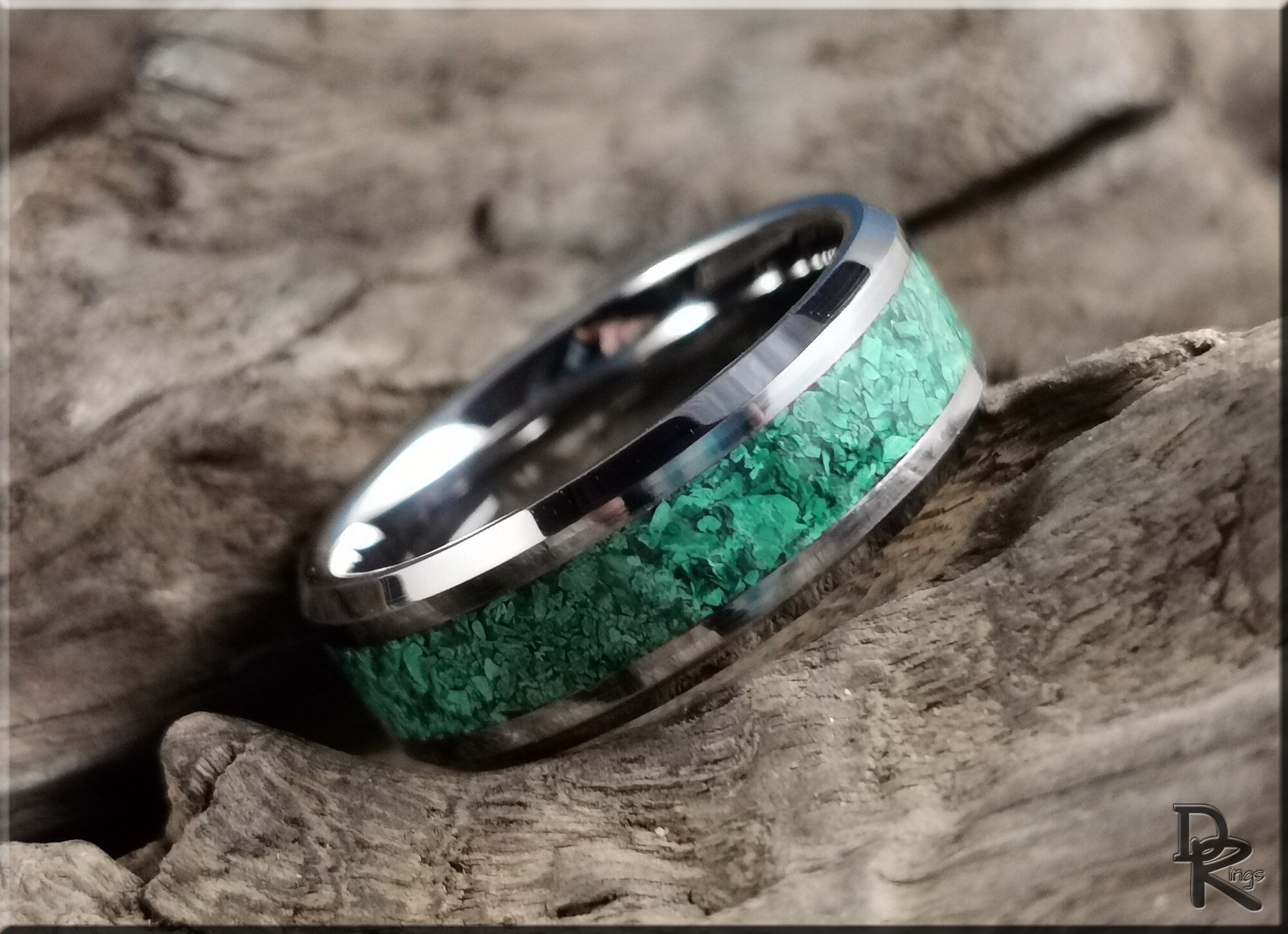 DR Rings tungsten ring with green malachite inlay on textured wooden surface