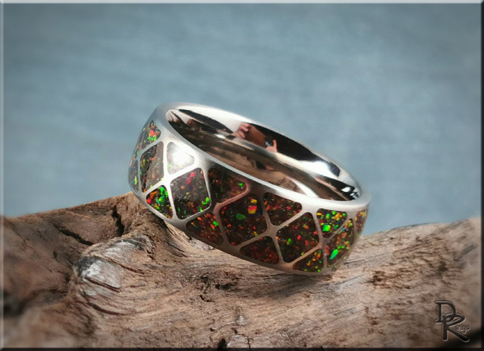 DR Rings titanium ring with opal inlay featuring colorful iridescent stones on a polished band