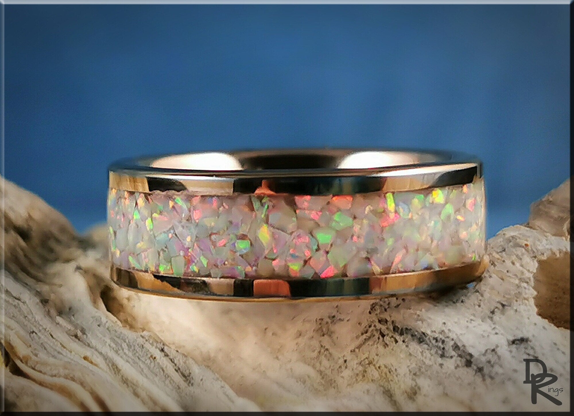 Rose gold ring with opal inlay by DR Rings showcasing iridescent colorful opal stones