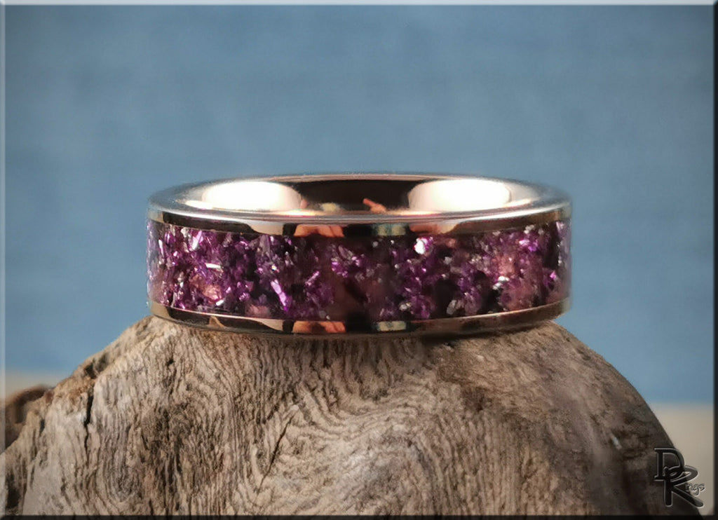 Rose tungsten ring with german glass in purple embedded design by DR Rings displayed on wood
