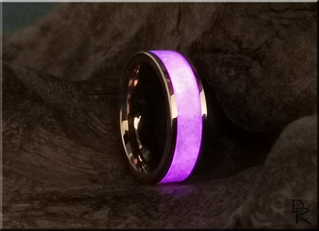 Rose tungsten ring with glow inlay glowing purple on dark textured background