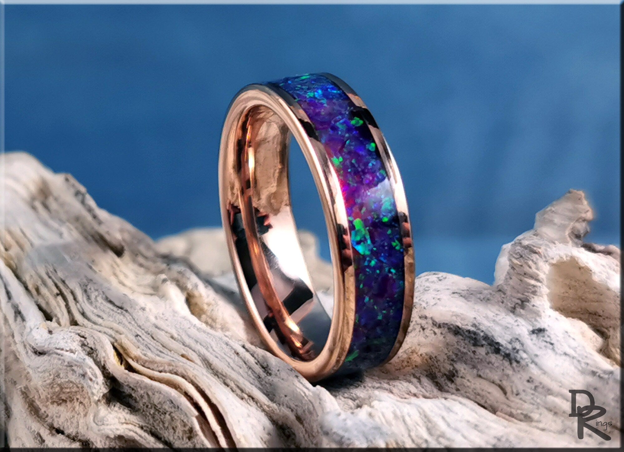 Rose tungsten ring with opal inlay featuring a vibrant blue and green iridescent design by DR Rings