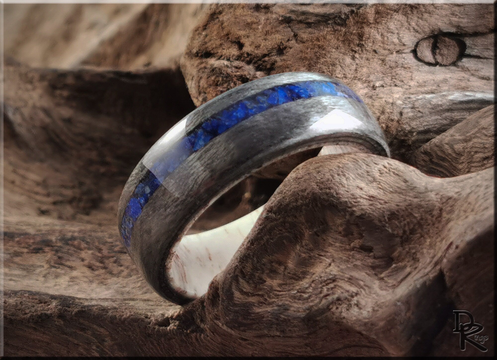 DR Rings silver band ring with a vibrant blue lazuli lapis inlay on rustic wood background
