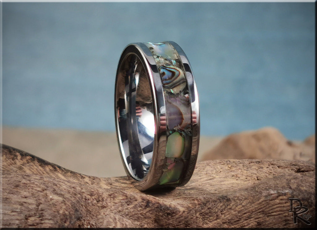 DR Rings super titanium ring with inlaid abalone shell design on sandy textured surface