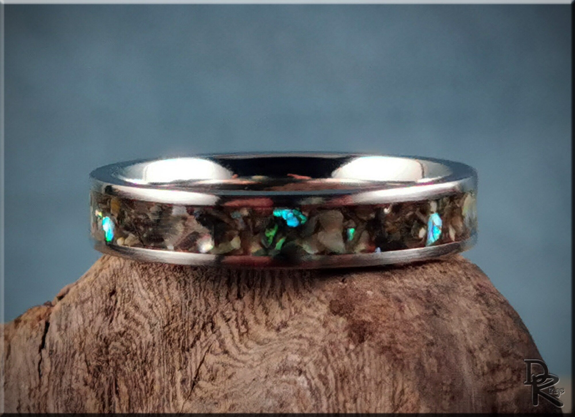 DR Rings titanium ring with abalone inlay featuring iridescent blue and green accents