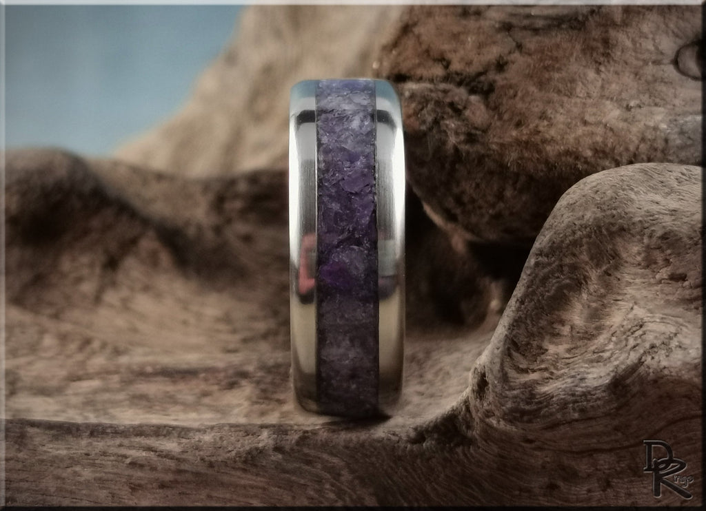 DR Rings titanium ring with amethyst inlay on textured natural wood background