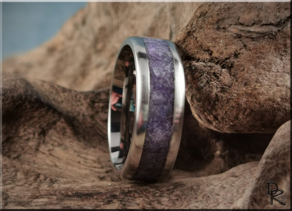 DR Rings titanium ring with amethyst inlay displayed on rustic wooden surface