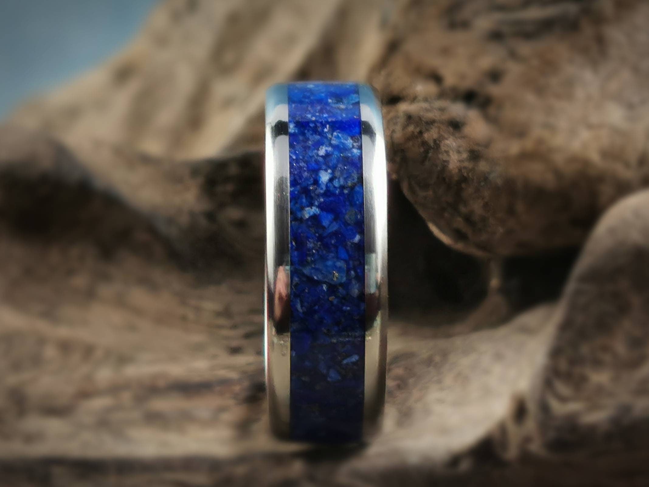 DR Rings titanium ring with lapis inlay featuring a polished silver band and blue stone center