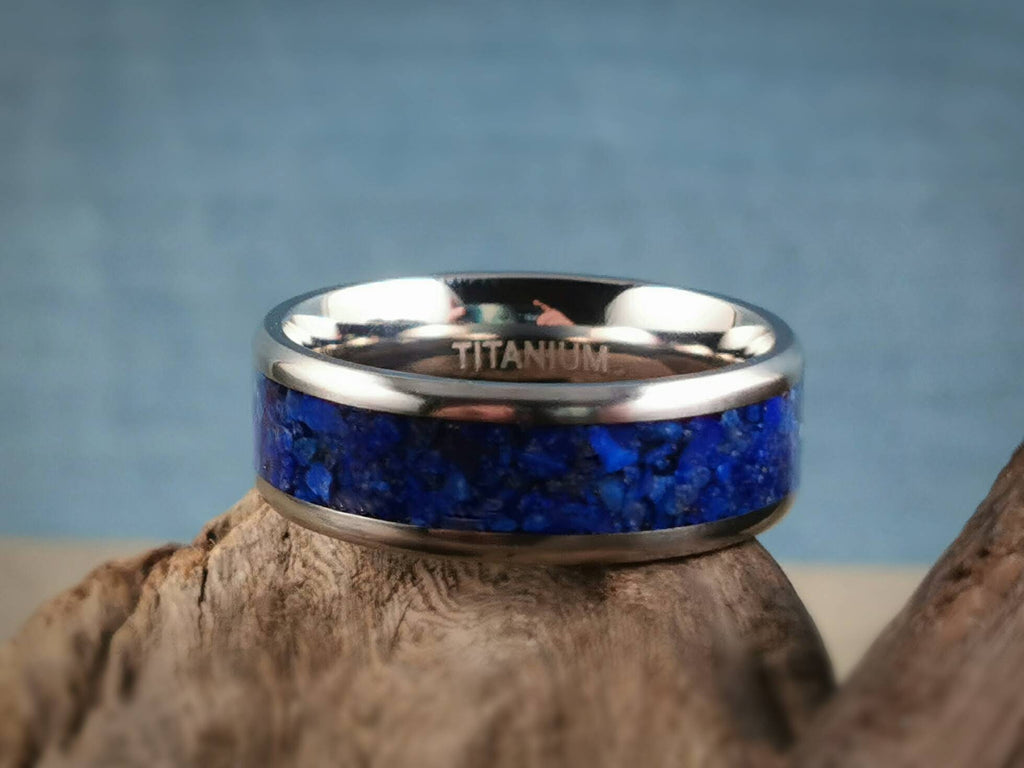 DR Rings titanium ring with lapis inlay with polished silver edges on wood background
