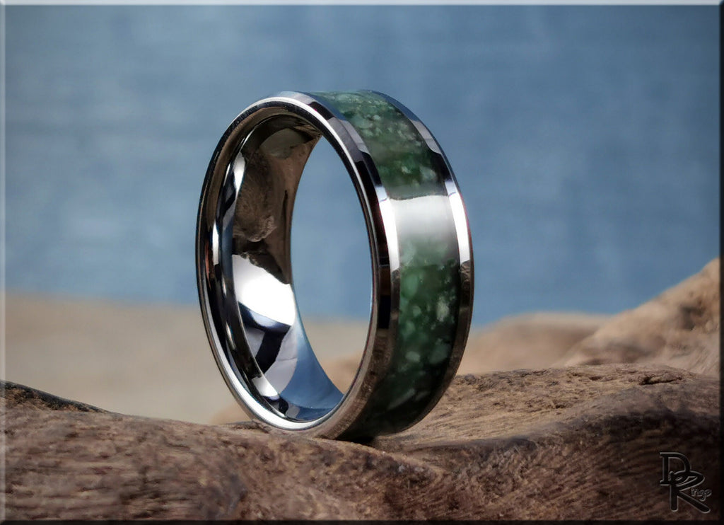 DR Rings tungsten carbide ring with inlay featuring green stone design on natural wood background