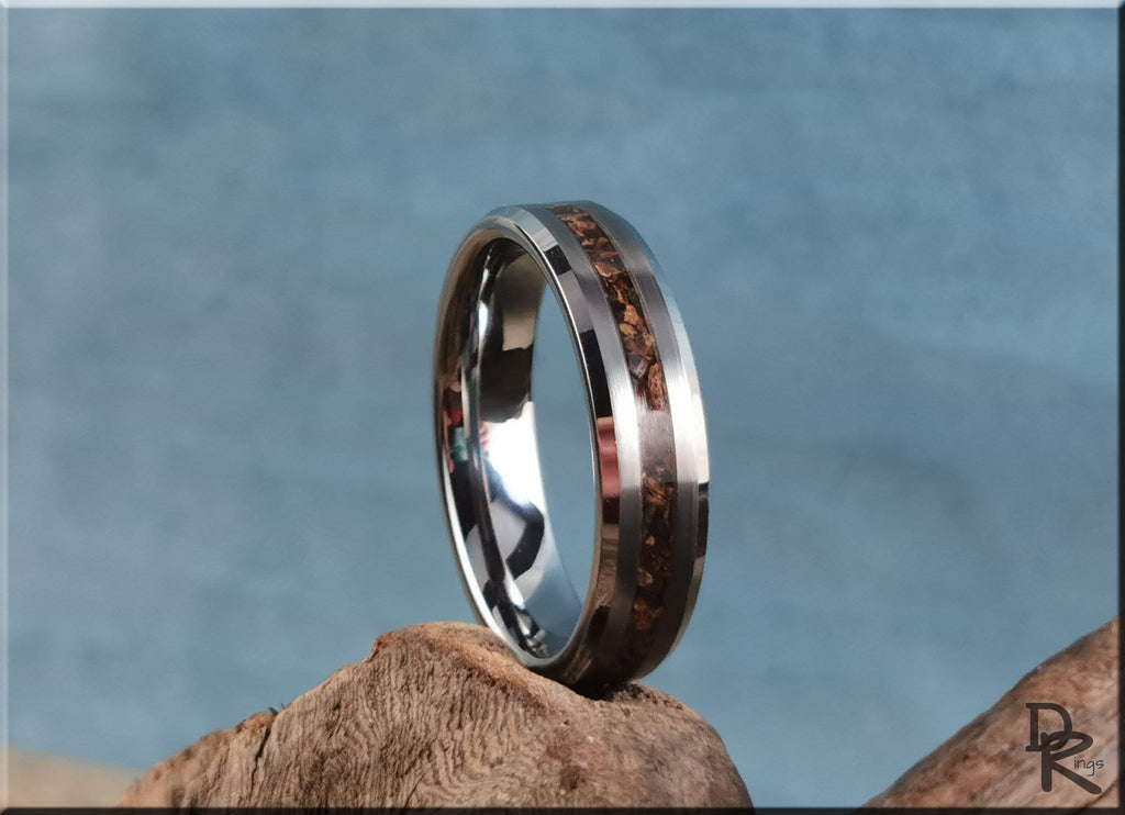 Tungsten carbide ring with inlay featuring a wood grain design on a polished silver band