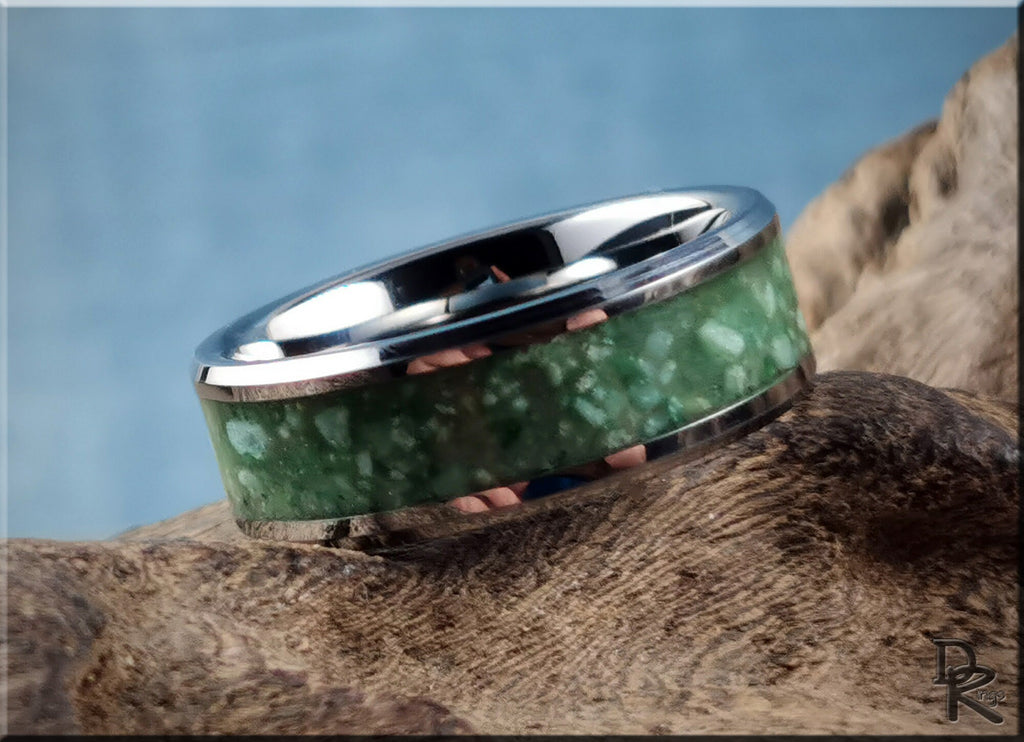DR Rings tungsten carbide ring with inlay of green stone on rustic wood background