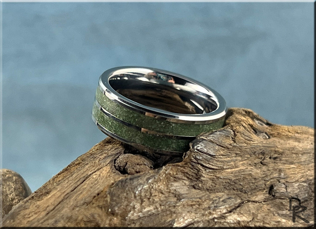 Tungsten ring carbide with emerald inlay on rustic wood background by DR Rings
