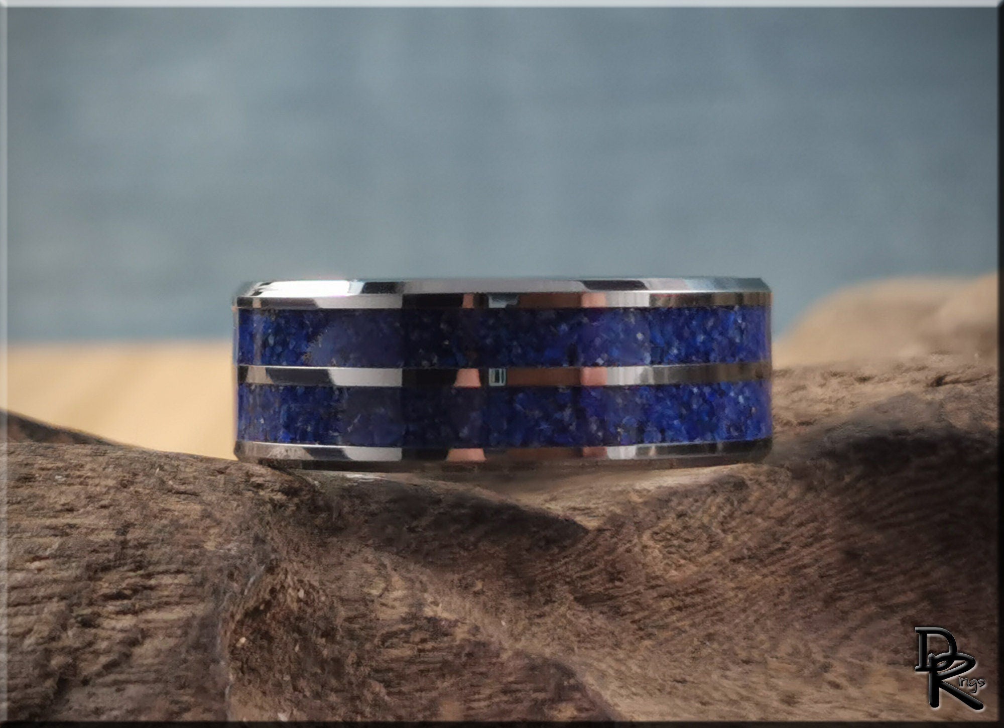 Tungsten ring with lapis lazuli blue stone inlay by DR Rings on rustic wooden surface
