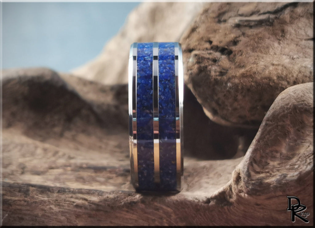 DR Rings tungsten ring with lapis lazuli blue stone inlay on natural wood background
