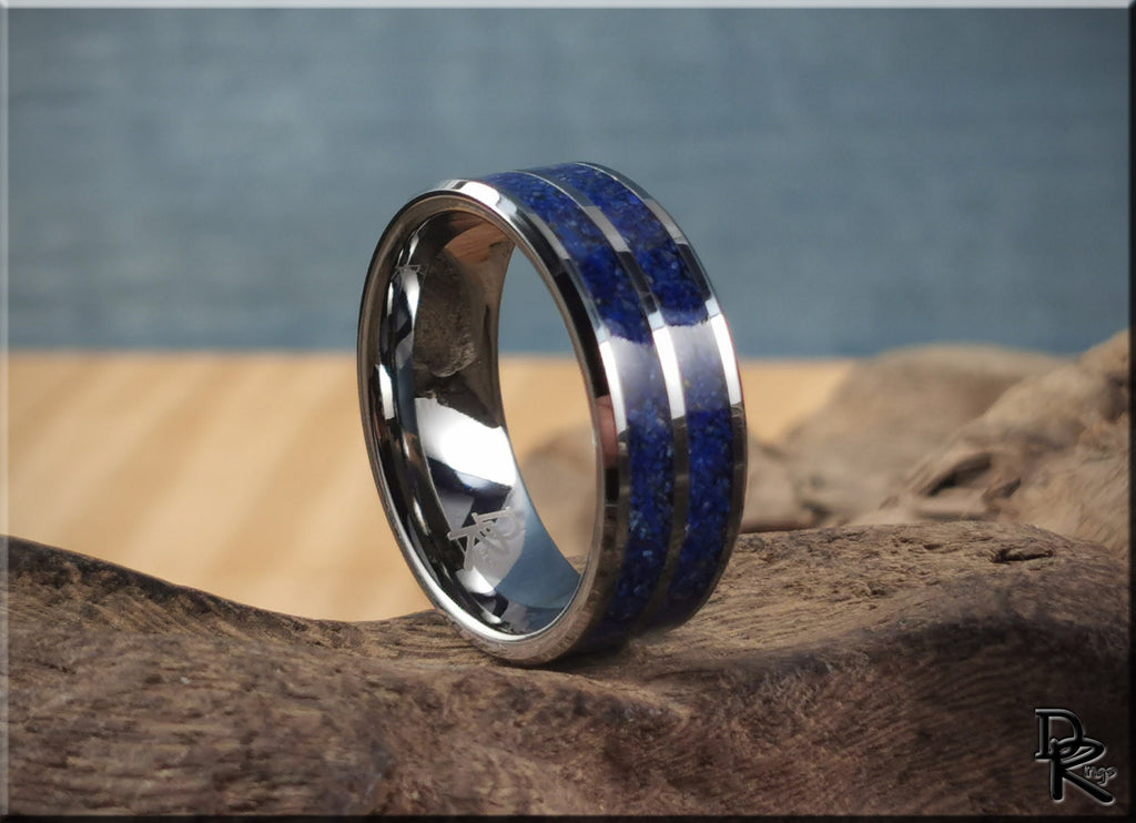 Tungsten ring with lapis lazuli blue stone inlay by DR Rings displayed on rustic wood