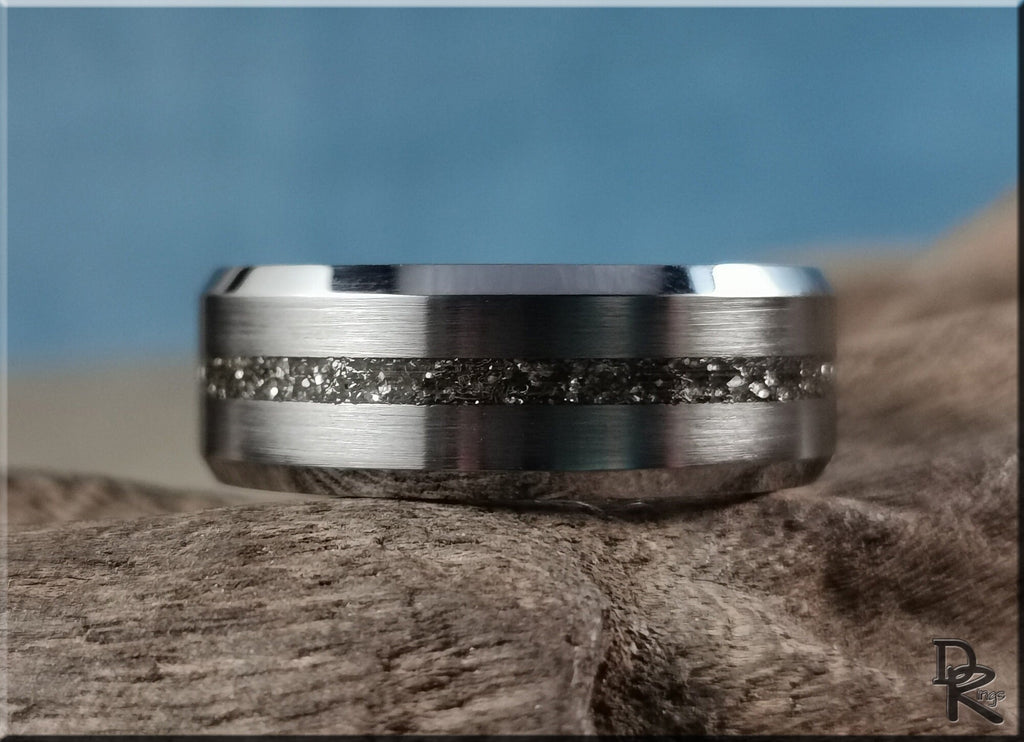 DR Rings tungsten ring with meteorite center in brushed silver finish on rustic wood background