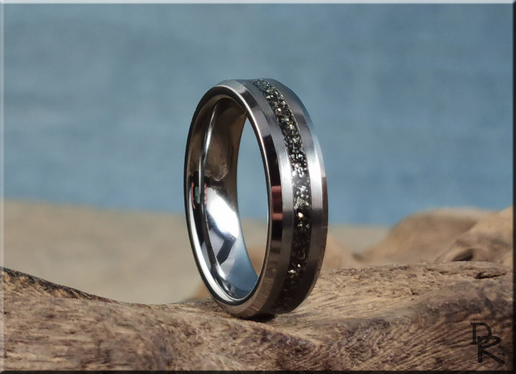 DR Rings tungsten ring with meteorite band detail on natural wooden surface