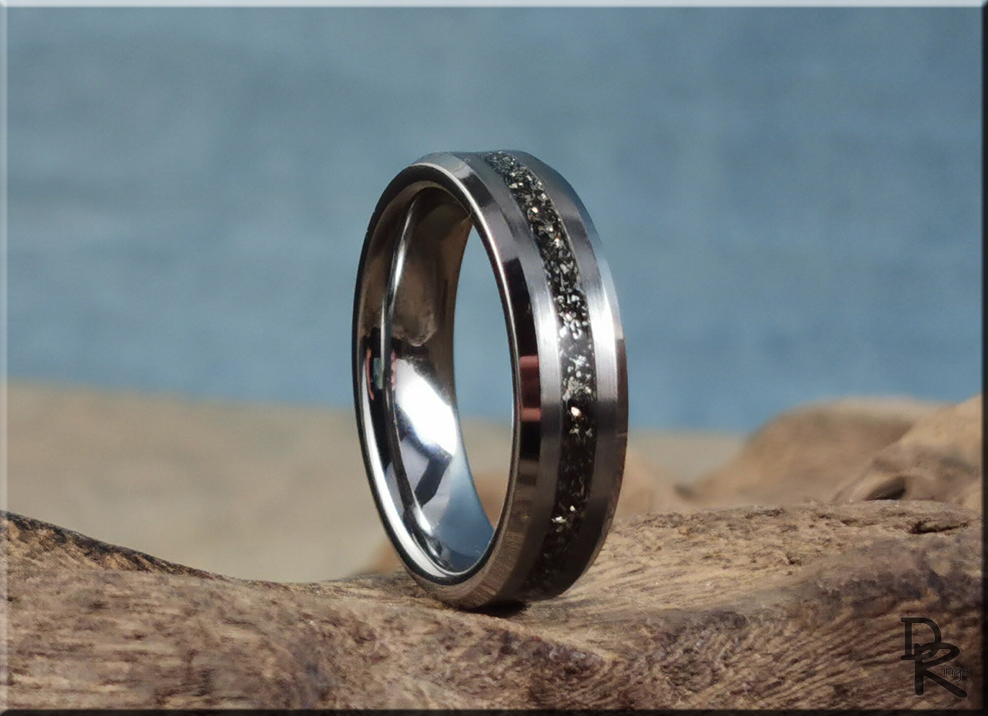 DR Rings tungsten ring with meteorite band detail on natural wooden surface