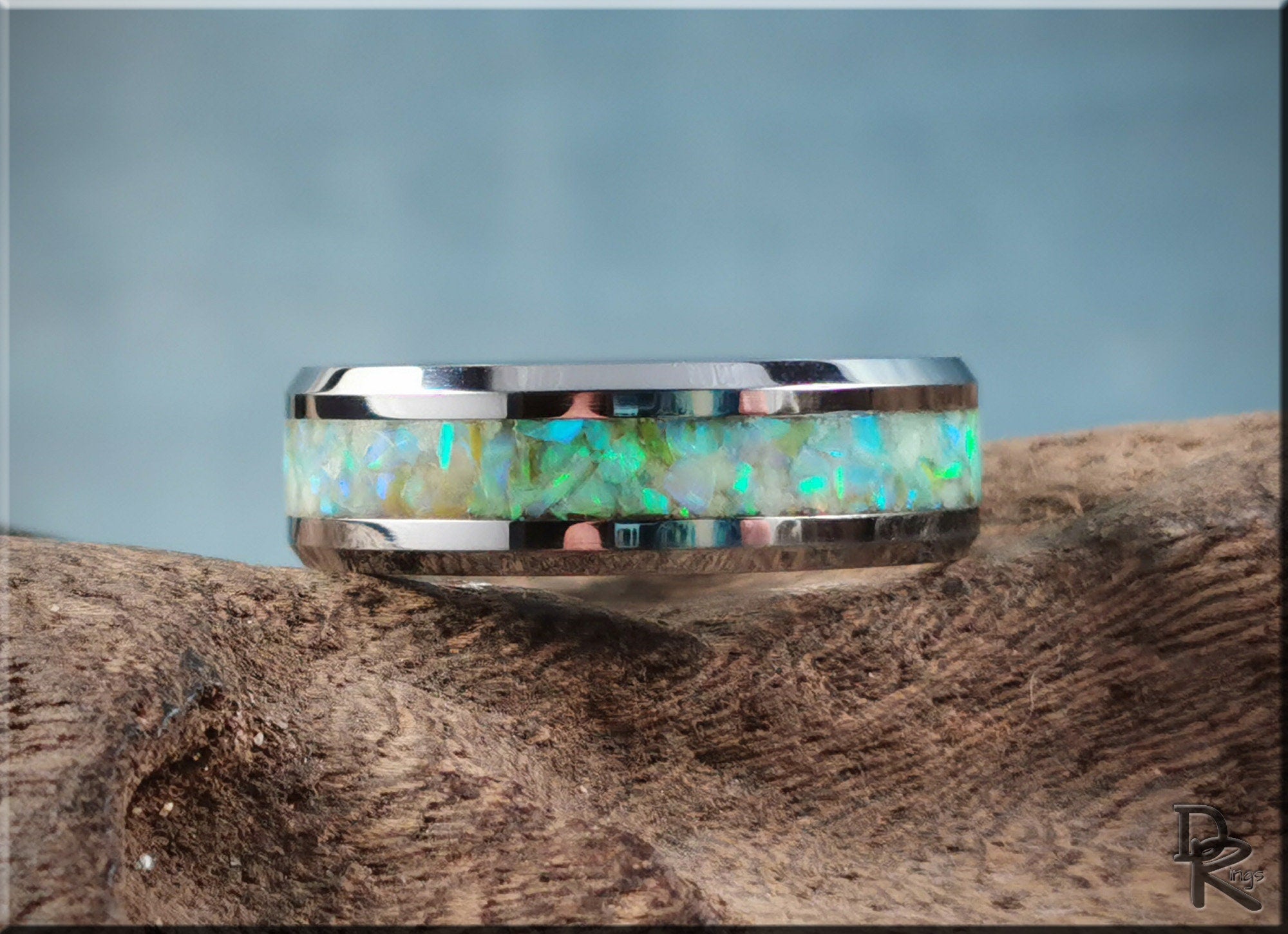 Tungsten ring with opal and glow inlay featuring vibrant blue and green shimmer from DR Rings