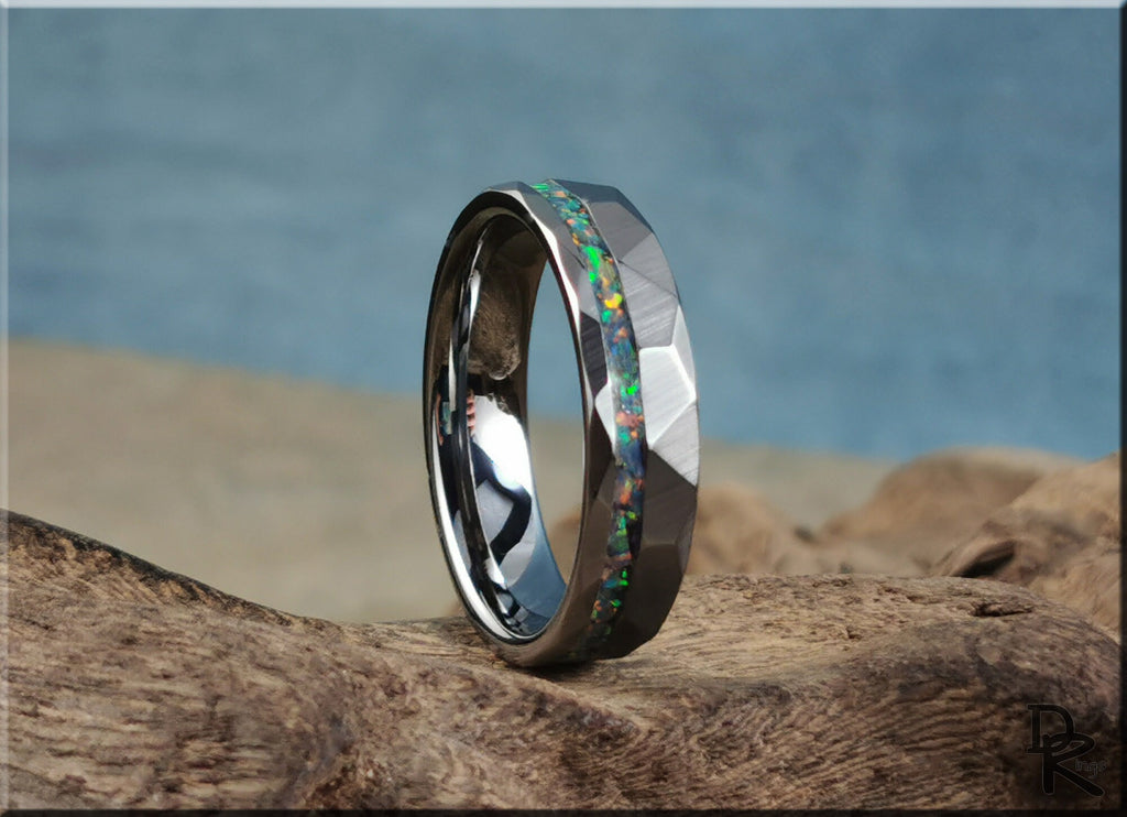 DR Rings tungsten ring with opal inlay featuring a faceted dark metal band and colorful opal strip