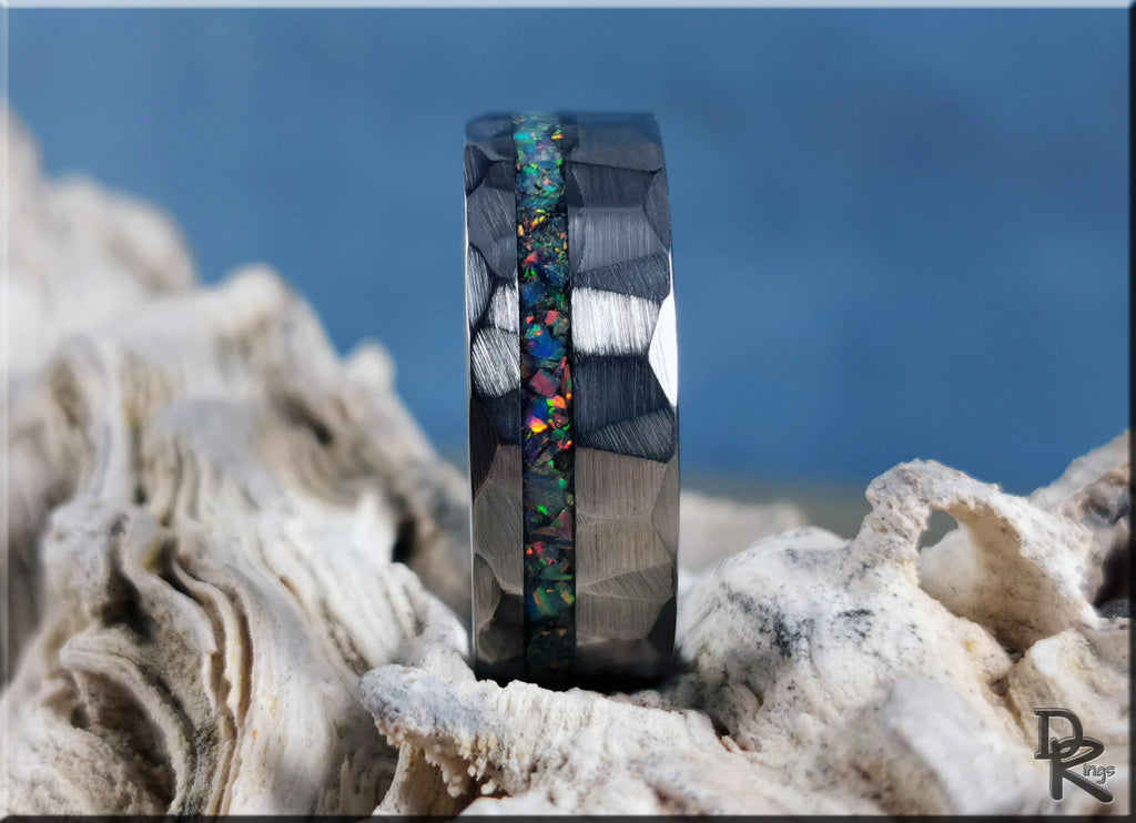 DR Rings tungsten ring with opal inlay featuring a faceted black band and colorful opal center