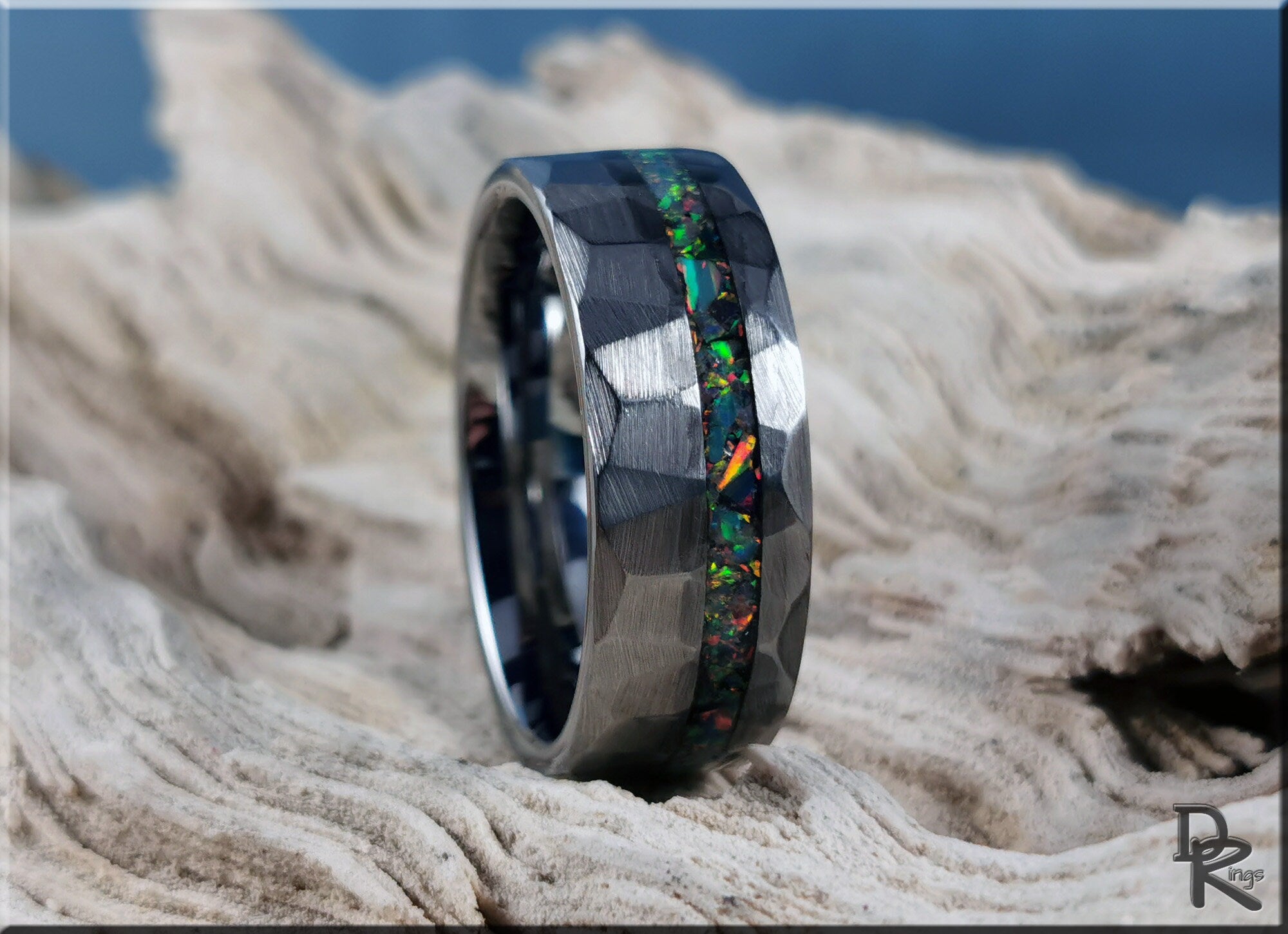 Tungsten ring with opal inlay featuring a hammered finish and vibrant multicolor opal strip