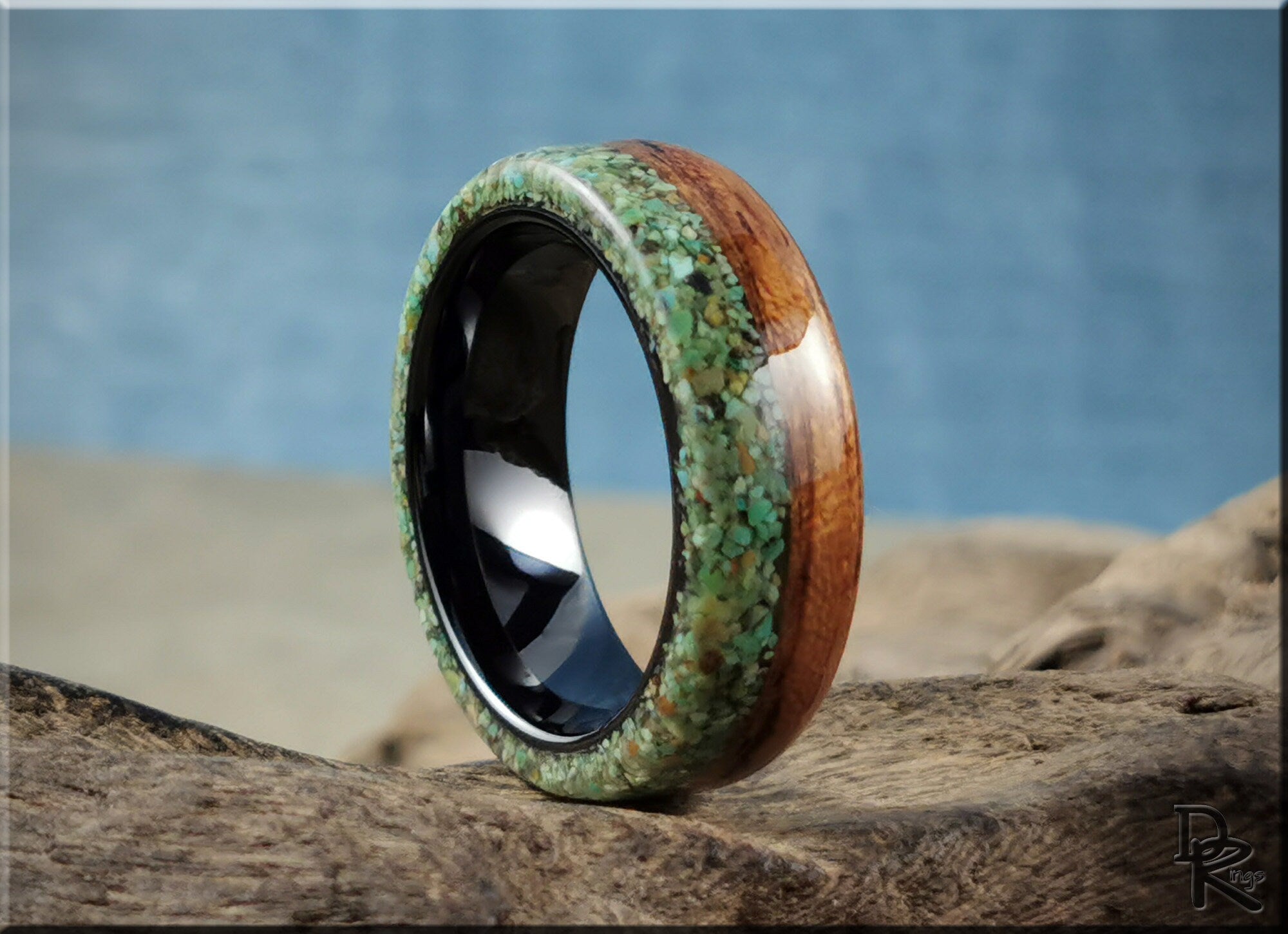 DR Rings turquoise inlay rings with polished wood and black inner band on natural background