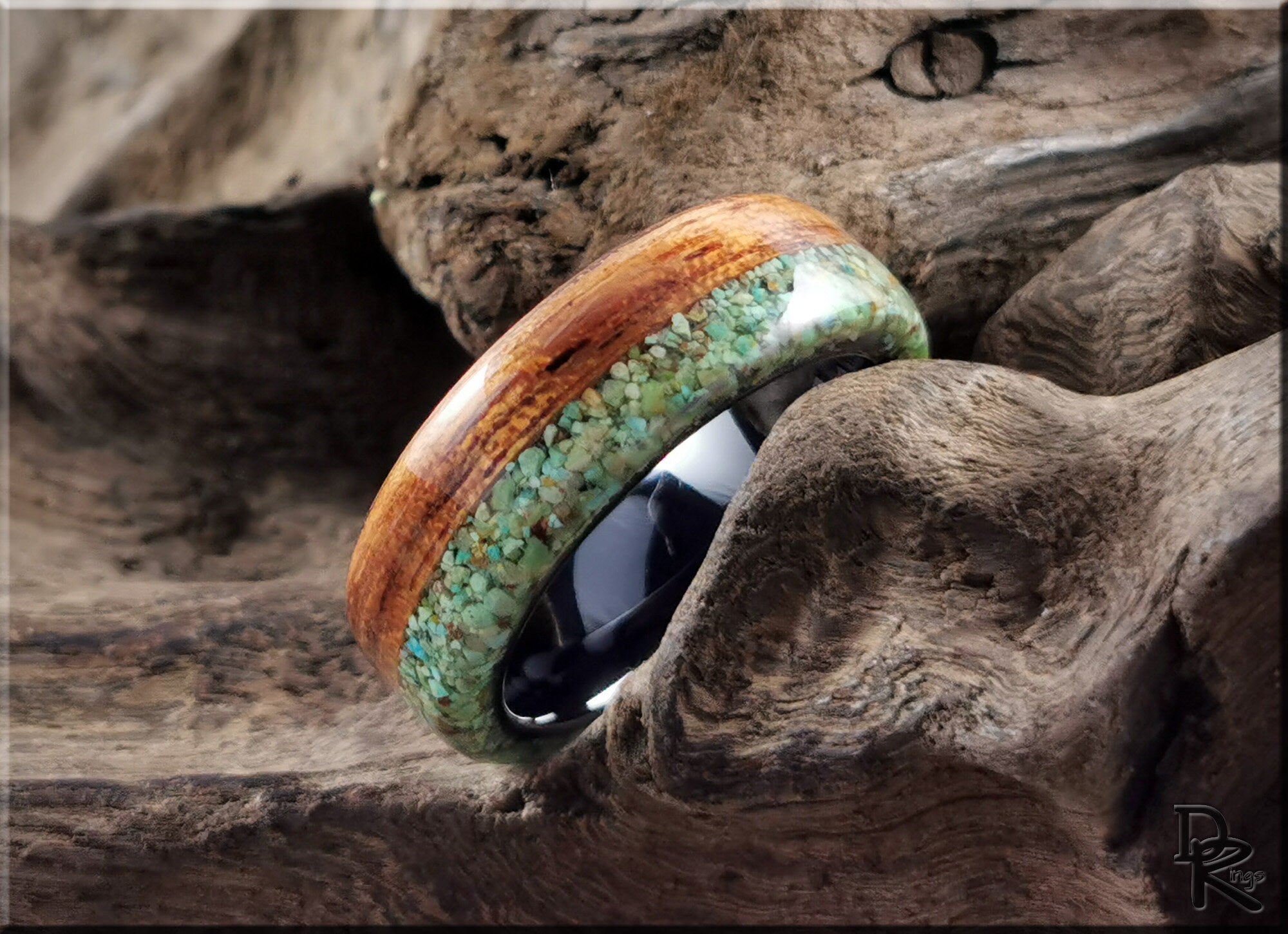 DR Rings wooden band with turquoise inlay rings displayed on rustic wood background