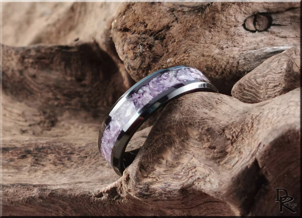 Ceramic ring with charoite purple stone inlay on textured wooden surface by DR Rings
