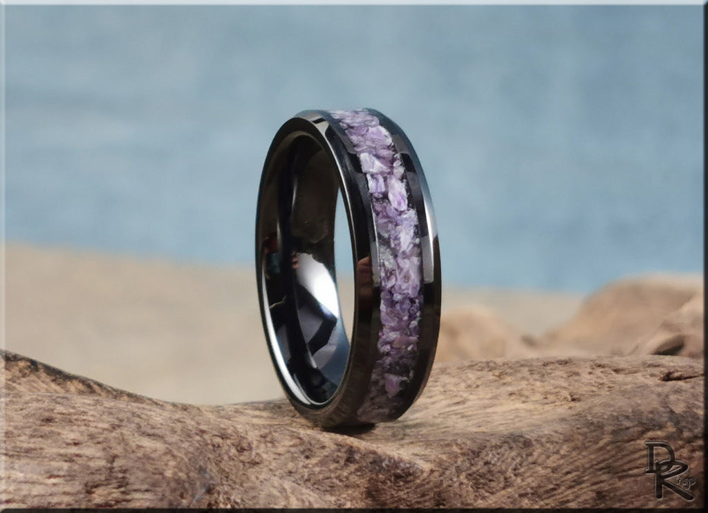 DR Rings ceramic ring with charoite inlaid on black band displayed on wooden surface